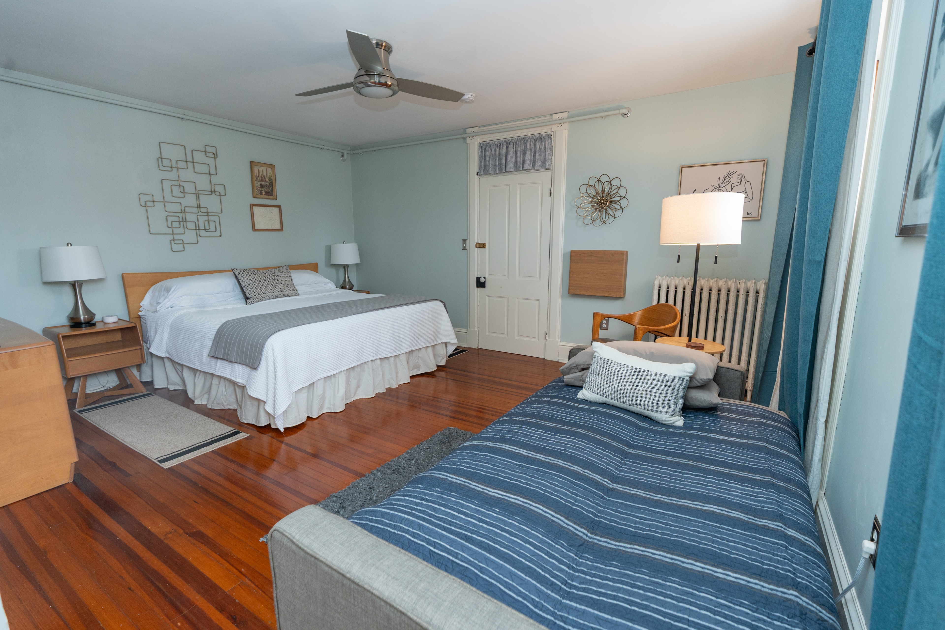 Convertible sofa set up as a bed for a third person in Baumgardner