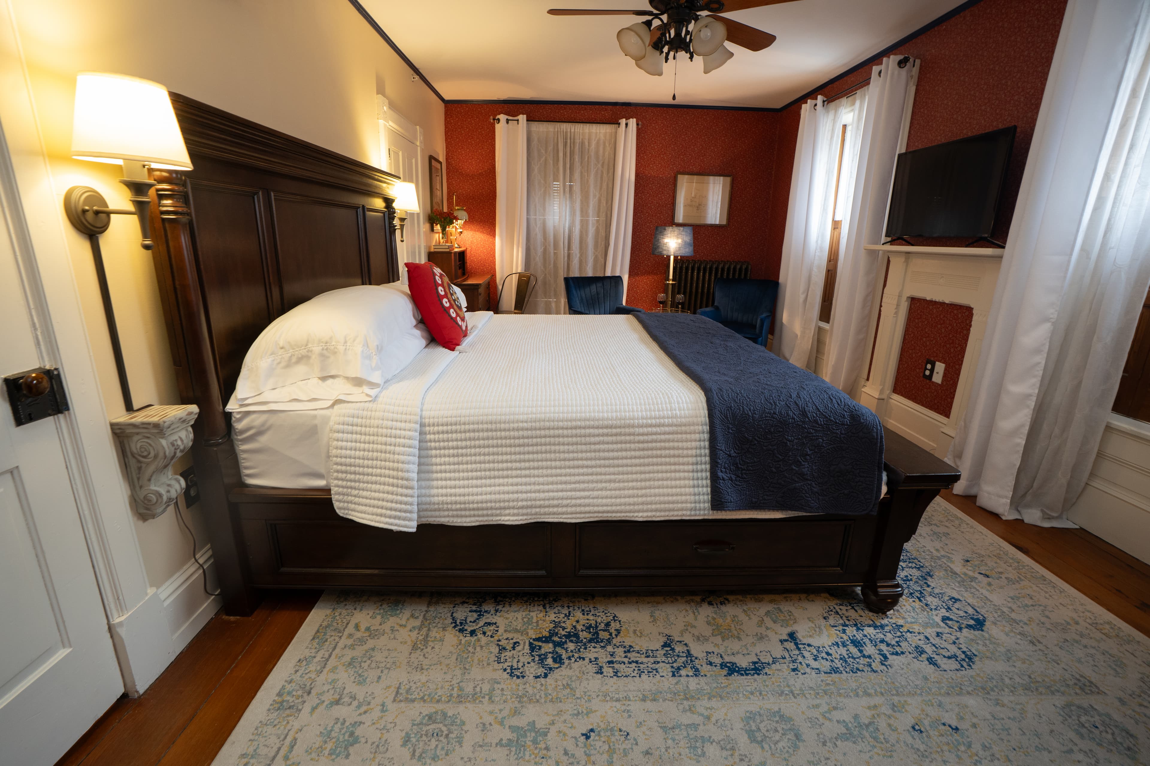 King guest room with bed in foreground and room extending beyond