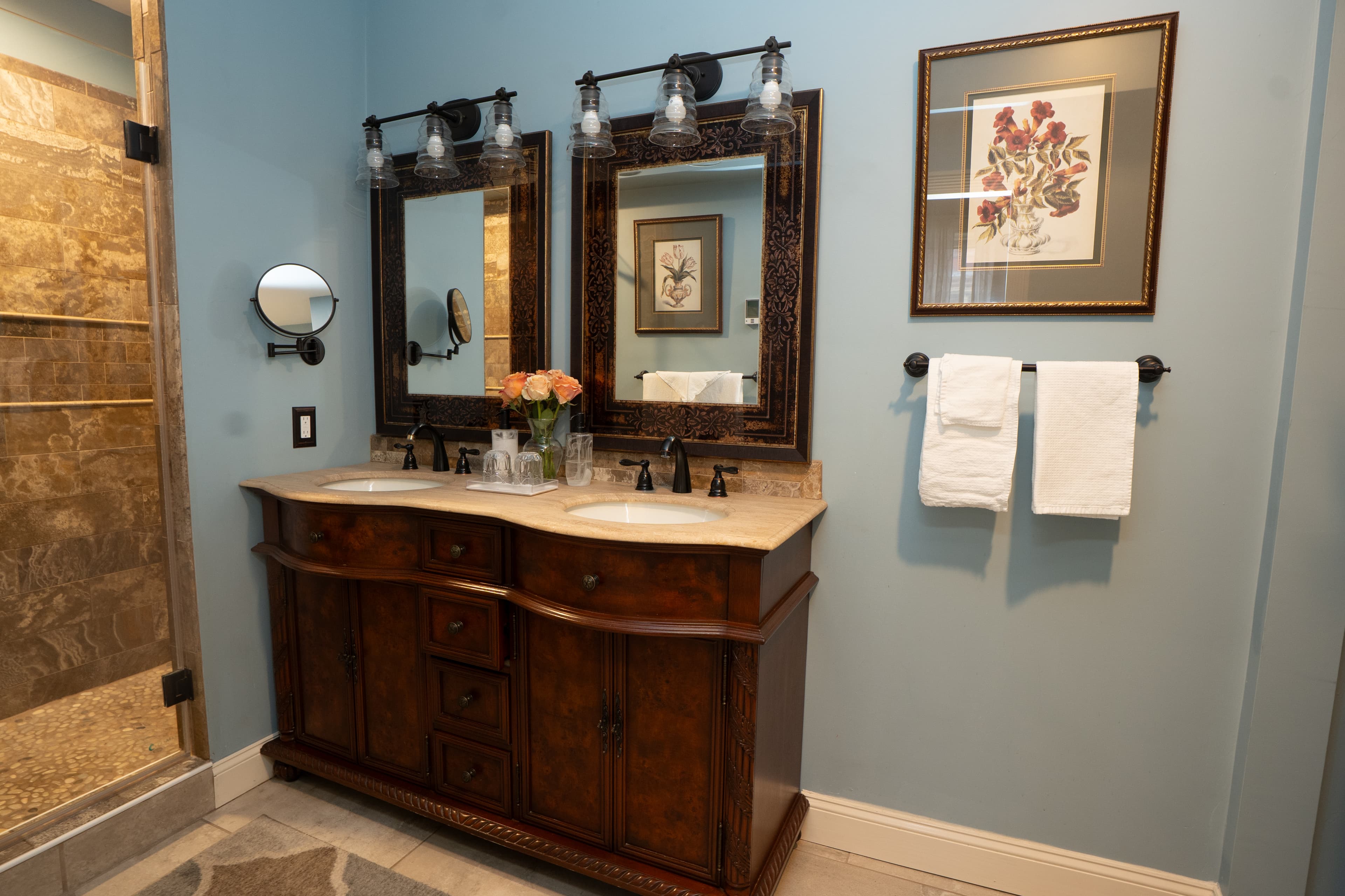 Double sink vanity with toiletries provided by the inn on the counter