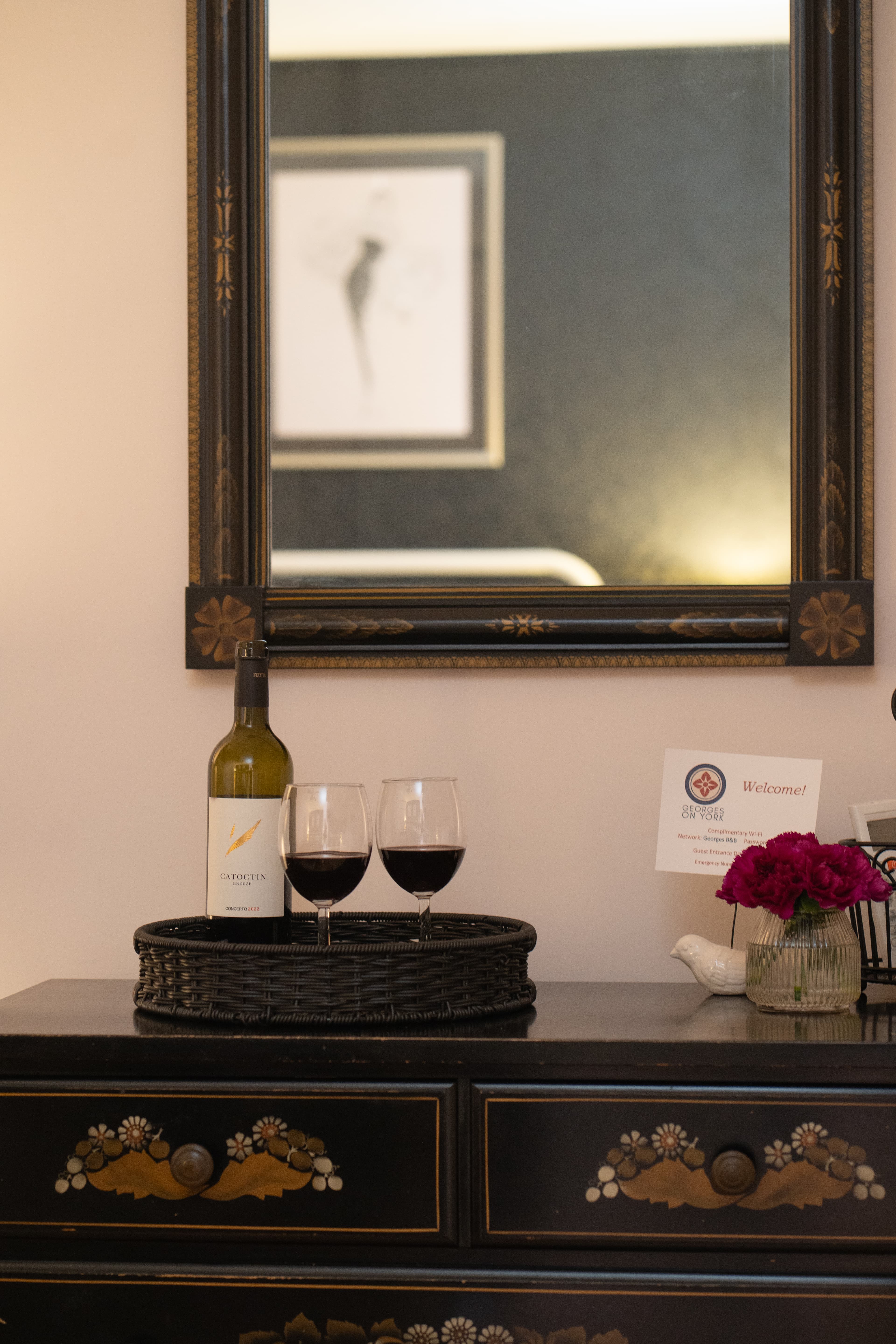 Elizabeth Room dresser and mirror with two glasses of wine on a tray