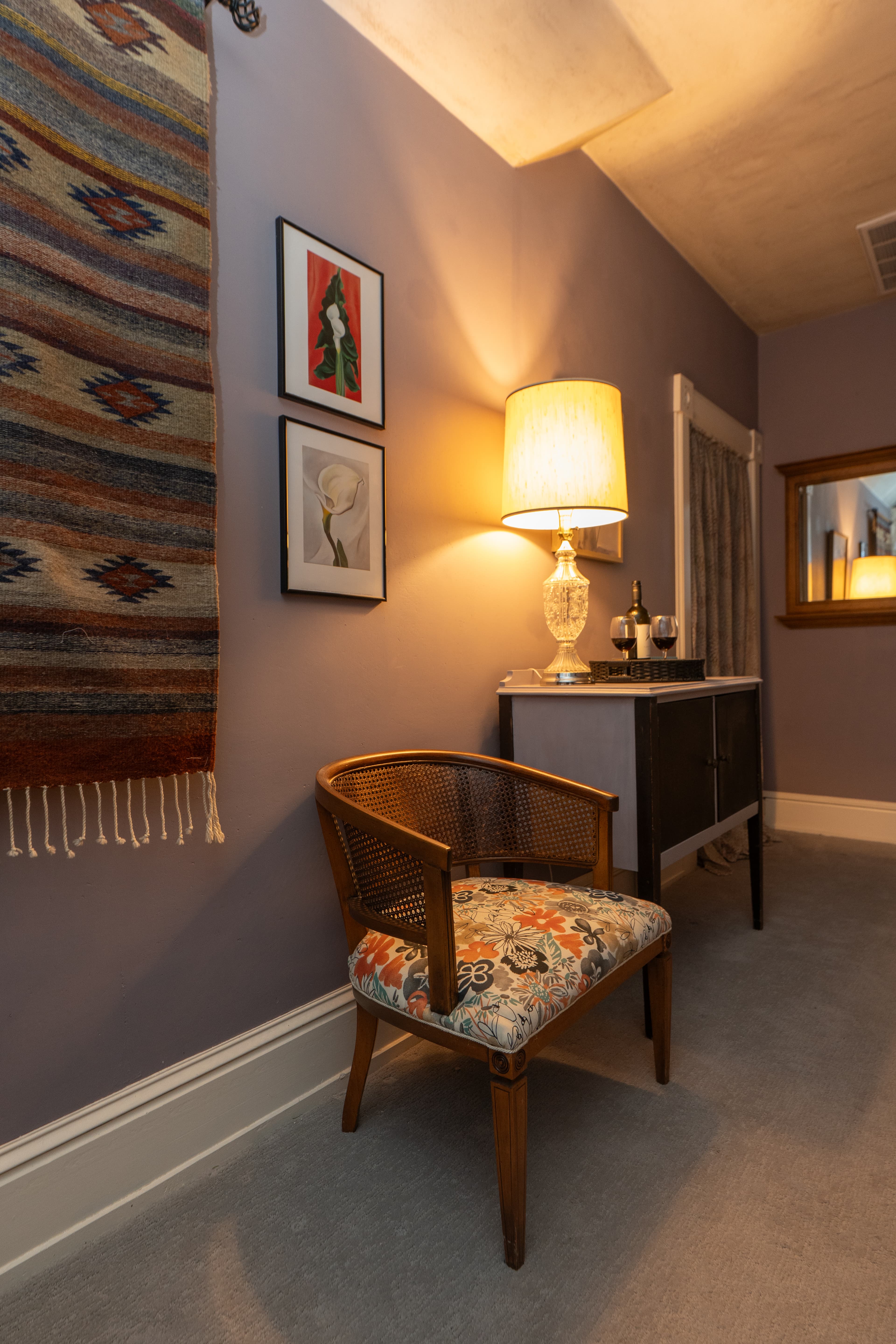 Landing outside the Parsons Room with cabinet, artwork and seating