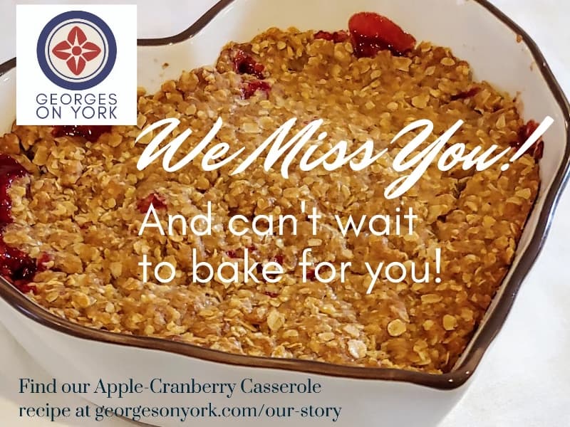 A baked apple-cranberry casserole in a dish with a message expressing eagerness to bake for customers.