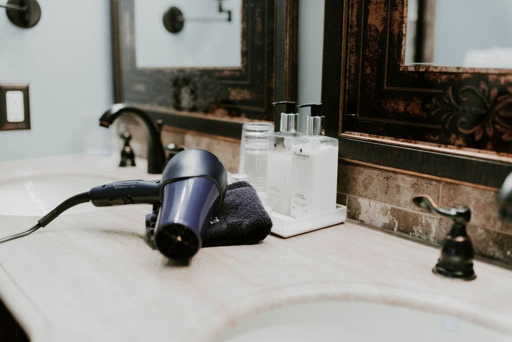 Detail photo of the Motter bathroom with a hair dryer on the counter
