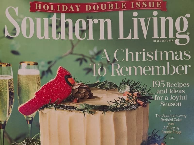 Cover of a Southern Living Magazine featuring a cake and a cardinal with 2 glasses of champagne